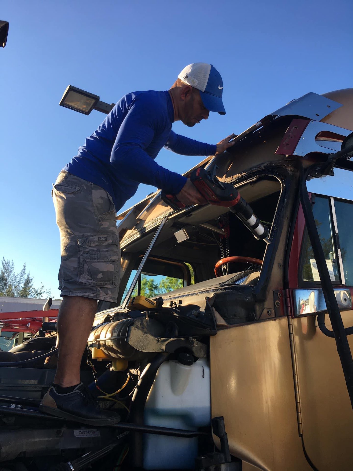 BG Auto Glass technician installing a windshield in West Palm Beach